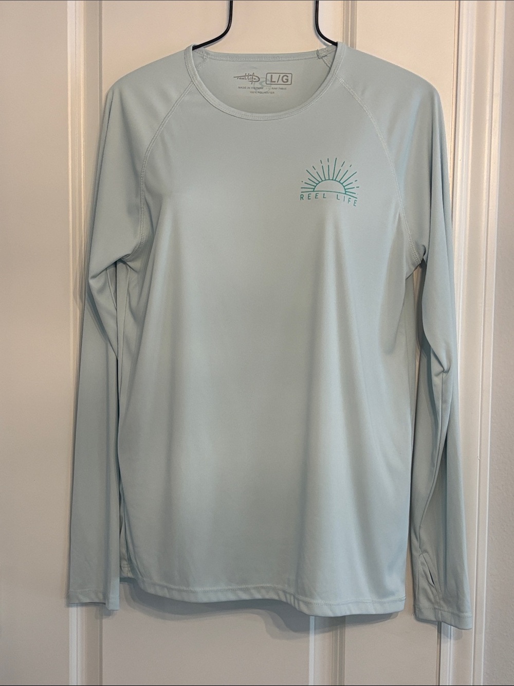 REEL LIFE Women’s Long Sleeve light Blue Performance Shirt. Large
